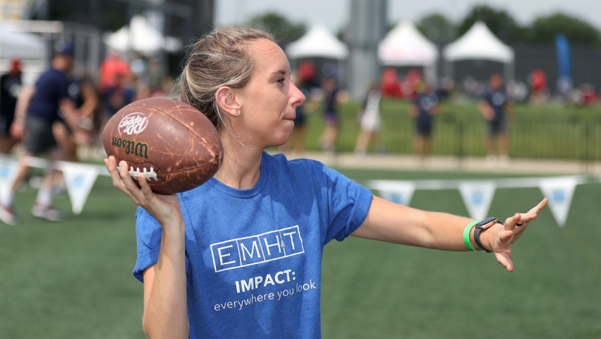 Woman throwing football