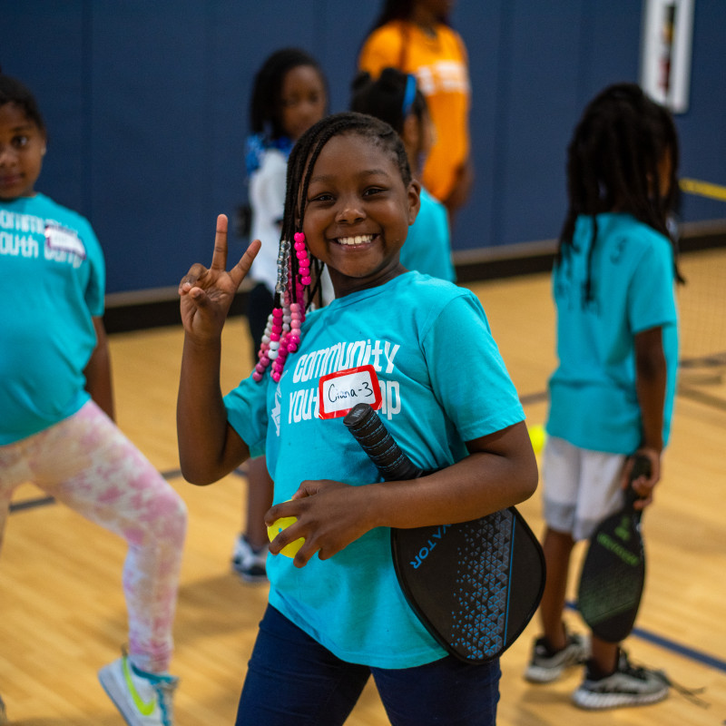 Child playing kickball